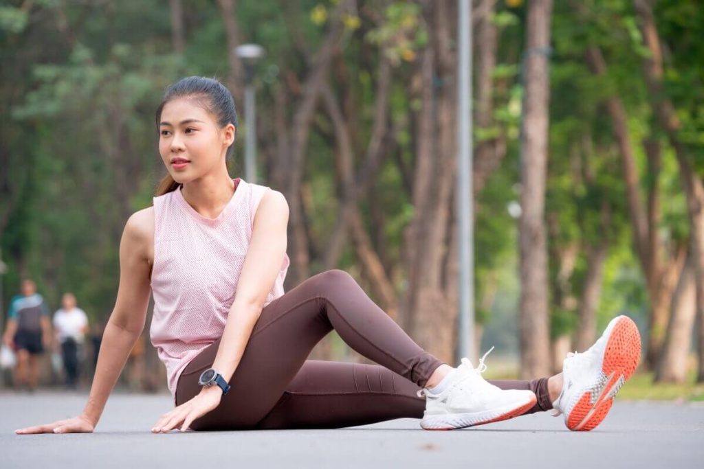 sport woman sit and stretching body