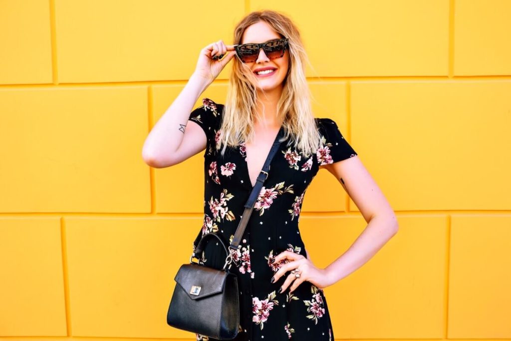 woman-posing-near-yellow-wall